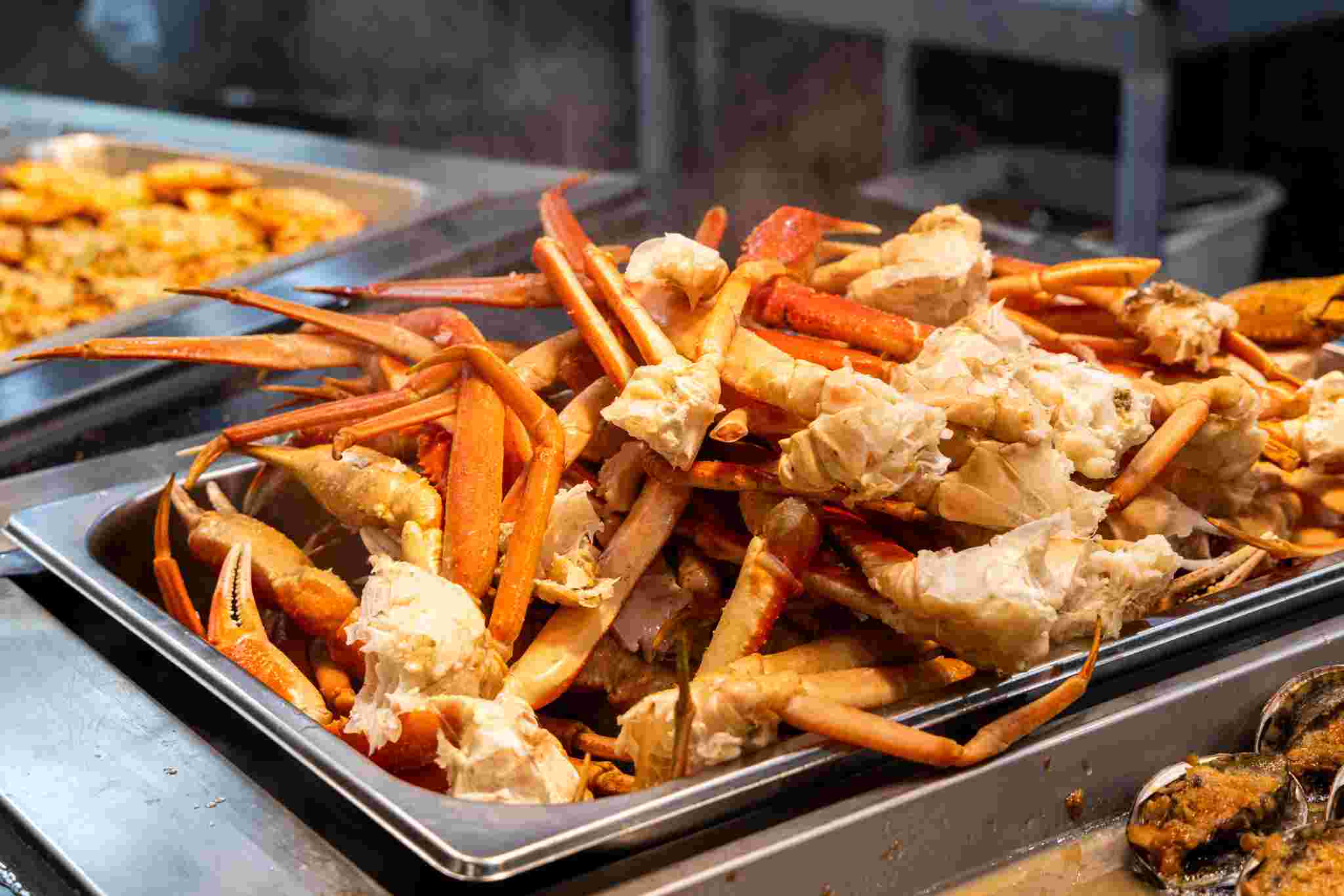 A bag of Cajun seafood boil — crab legs, shrimp, corn, potatoes